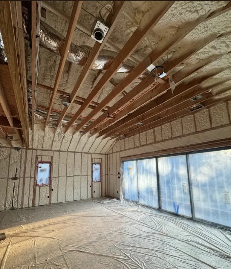 Interior walls and ceiling insulated with spray foam during new construction in Gulfport
